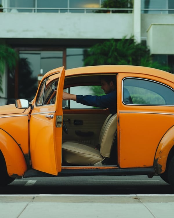 Close-up of steering wheel showing controls and airbag cover, inspector's hands at ten and two, bright interior from open sunroof